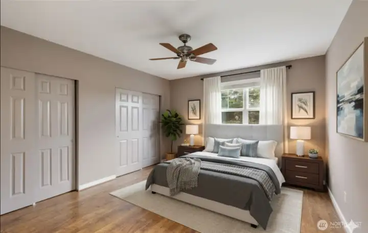 Virtually staged bedroom.  Entire side of room offers plenty of closet space and there’s room for a dresser and vanity if you’d like. Supports king or queen sized beds, either one.
