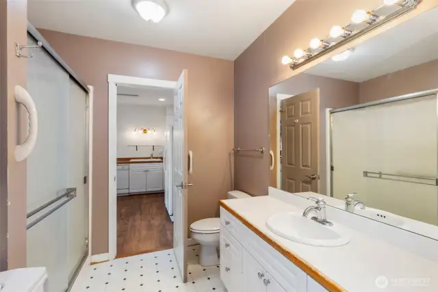 Shower with rain glass doors and easy to maintain spaces.