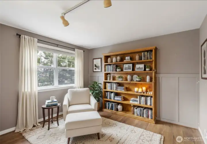 Virtually staged extra living area just off front door entry and the main living area. Could be used as a reading nook, office or TV/media room.