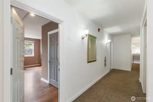 Entry from the upper hallway with elevator