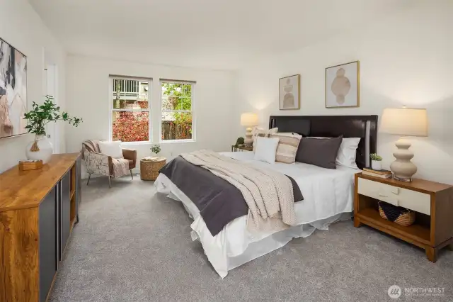 The primary suite is with new carpet and paint is a welcome retreat from a long day.