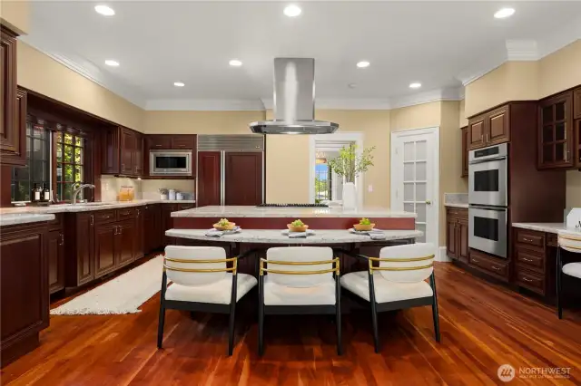 Expansive kitchen with stainless steal appliances, ample prep space and a walk-in pantry.