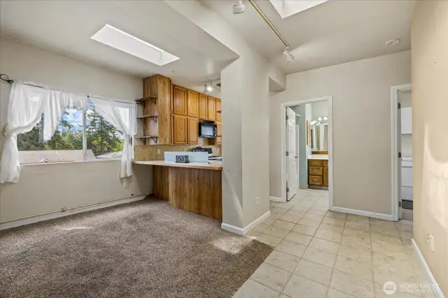 Looking to kitchen and down the hall to bath