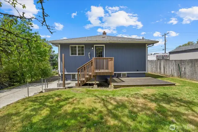This is the back of the home showing the entrance to the upstairs kitchen. There is also a separate entrance to the lower level