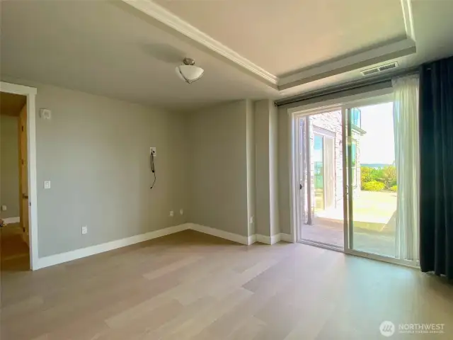 Primary bedroom is spacious and has slider that opens to side patio...enjoy your morning coffee outside and enjoy star gazing in the evening on your private side patio!