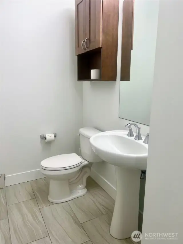1/2 Guest bath is perfectly located in the hallway as you enter!