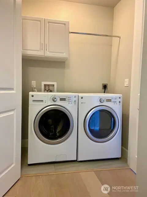Utility room with storage...Washer and dryer stay for your convenience!