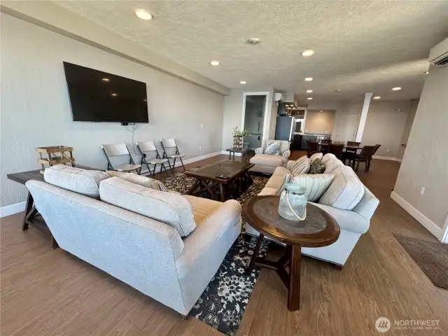 Also included is the reserved use of this spectacular 5th floor CONDO-OWNERS ONLY lounge...Perfect for business meetings and gatherings.  Panoramic PNW views from this comfortable space, complete with kitchen facilities, a television and a fire pit!  Has doors and sliders that access outside concrete deck with unobstructed, sensational views!