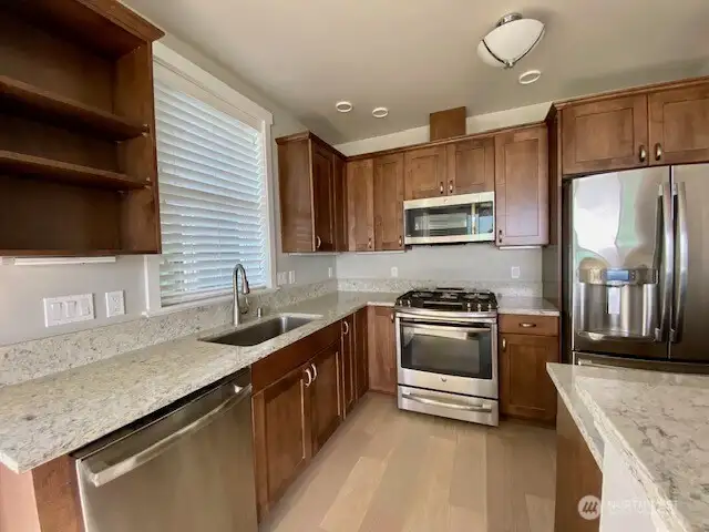 Kitchen with Granite countertops and high end SS appliances, including new dishwasher (9/2023.)