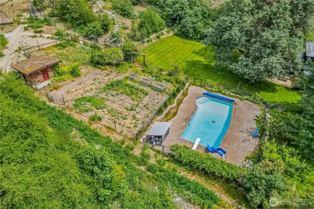 Grow your own food, relax in the pool, and soak in the peace of this sublime property.