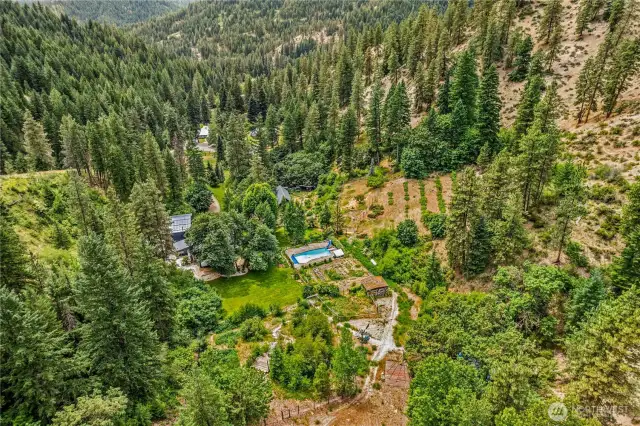 A true mountain sanctuary, with a vegetable garden, orchards, a pool, and forested hillside, offering the ultimate canvas for recreation, or simply living in rhythm with nature...truly a one of a kind property!