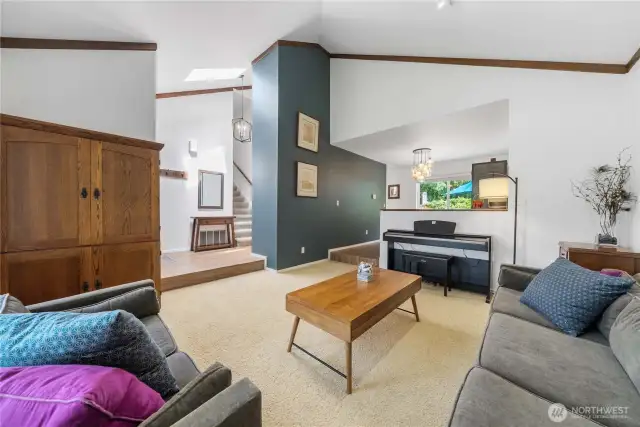Bright and Inviting Living Room with Vaulted Ceilings.