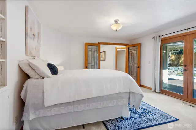 Primary w/  French doors into room and out to backyard and deck