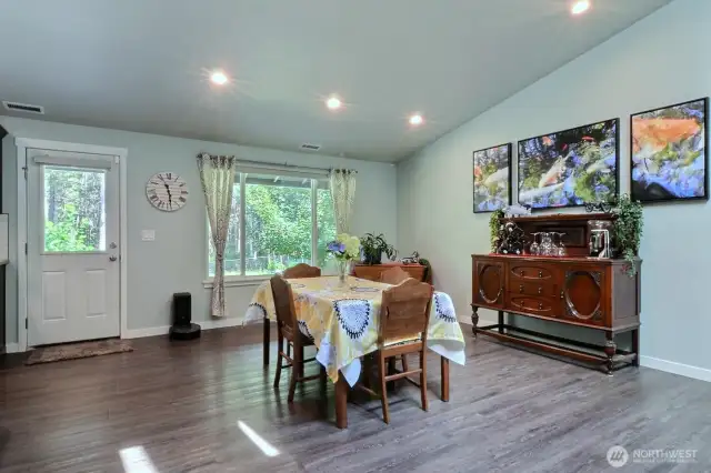 Entertain friends and family in the dining area. Looking out to the fruit trees and the acreage beyond.