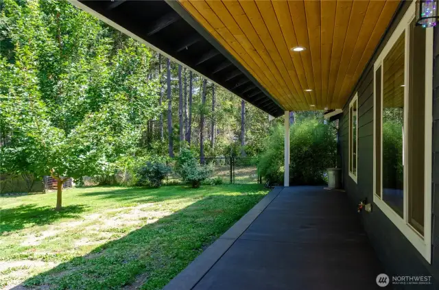 Covered back patio. Imagine a hot cup of coffee or tea back here in the morning ?