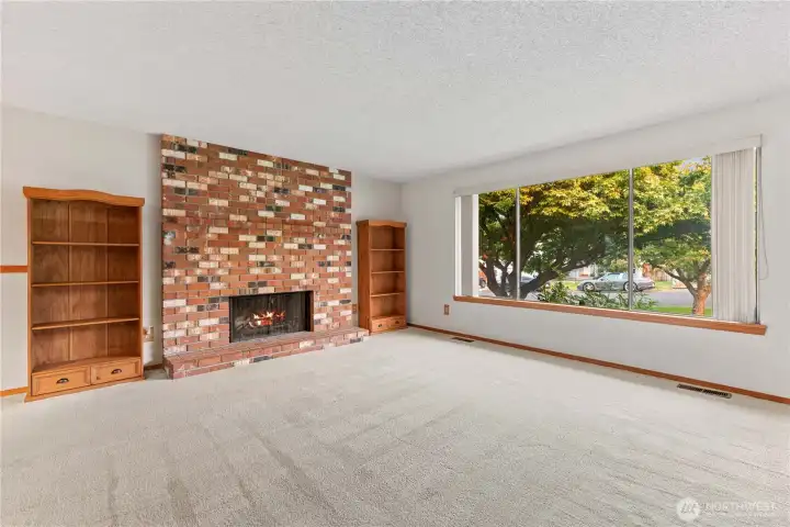 Sunny living room warmed by wood burning fireplace