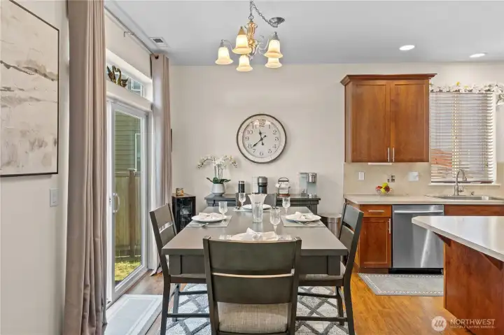 Dining area with slider to your backyard patio