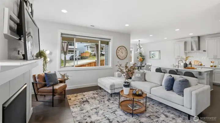 Natural light fills this spacious great room, creating the perfect setting for everyday living and entertaining.
