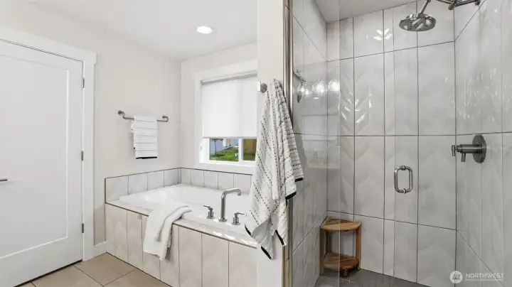Relax in the spacious soaking tub or enjoy the sleek glass-enclosed shower—your own personal spa