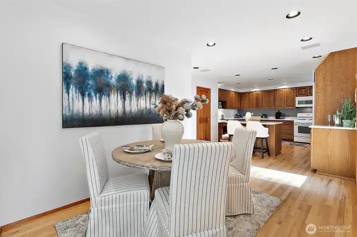 Breakfast nook is a charming segue between the formal spaces and the kitchen