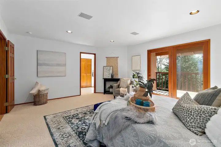 Primary bedroom with large en suite bathroom and walk in closet.