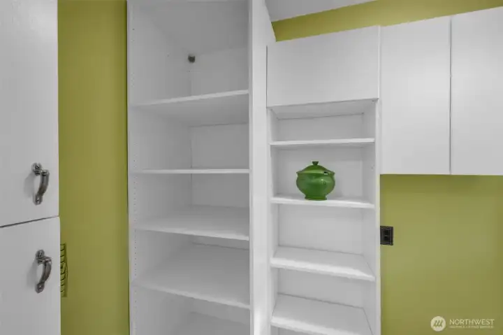Additional pantry storage in hall behind the kitchen.