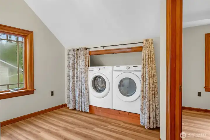 Upstairs hall laundry and luxury vinyl planks throughout 2nd floor.