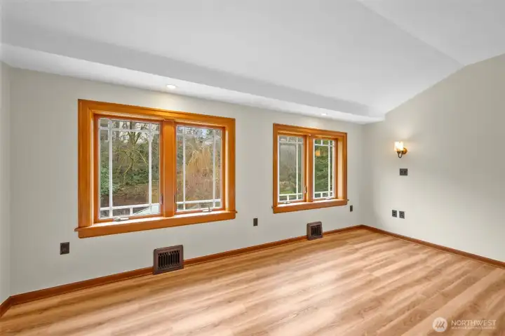 Primary bedroom windows provide an awesome view of the creek and greenbelt.