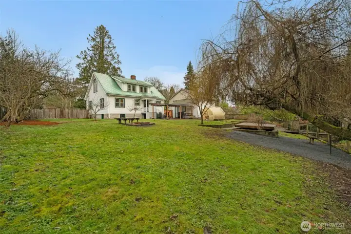 Heirloom lilacs, rhododendron bushes and an apple tree fill the back yard with gorgeous blooms each spring.