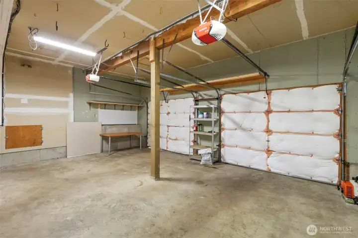 Two car garage with plenty of storage space and automatic openers.