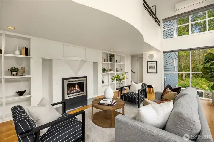 Polished wood floors and gallery-white walls enhance the home's clean functional aesthetic- designed for both beauty and ease of maintenance.