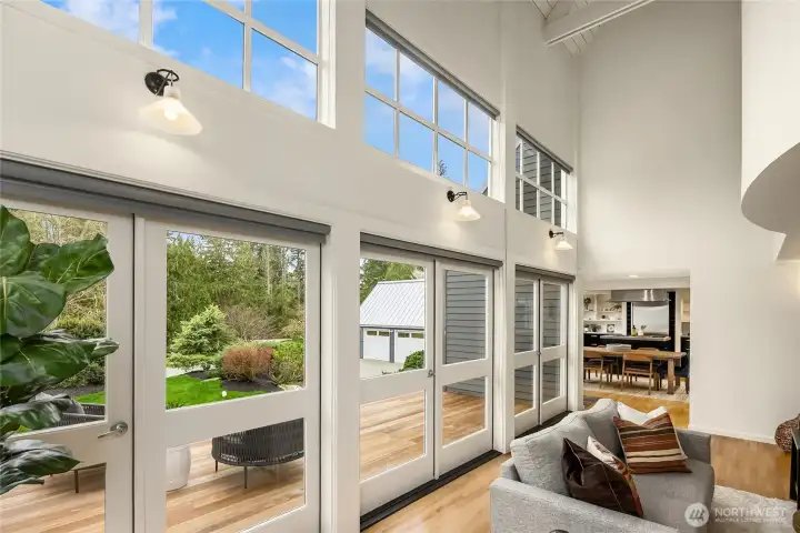 Light floods the living room and when the French doors are opened, the division between living room and deck disappears, making the two spaces one.