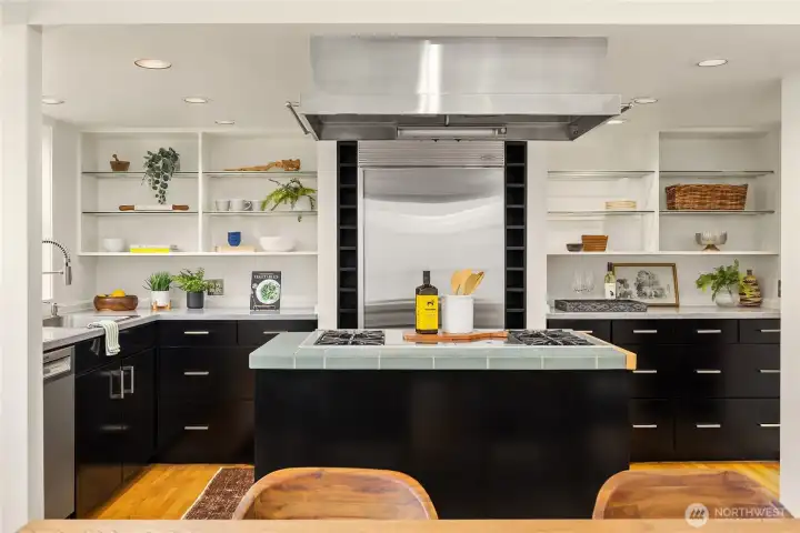The cooking island divides the dining room and the kitchen.