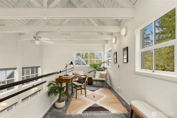 the Mezzanine Level Office with exposed trusses and open to the living room below.