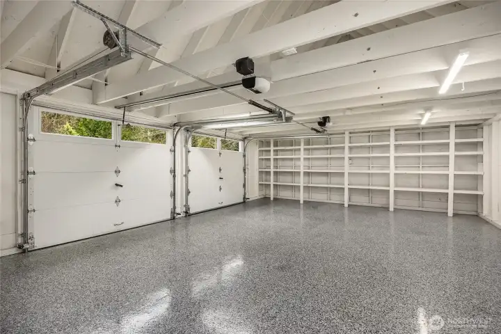 This fabulous garage, offers new EV Charging  built-in storage and beautiful epoxy flooring. The 2-garage door openers are new.
