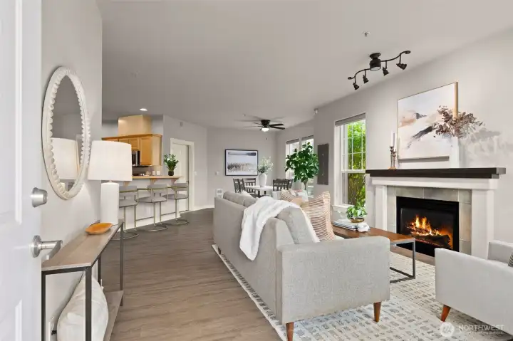 This open floor plan lives large, flowing seamlessly between living room, dining room, and kitchen