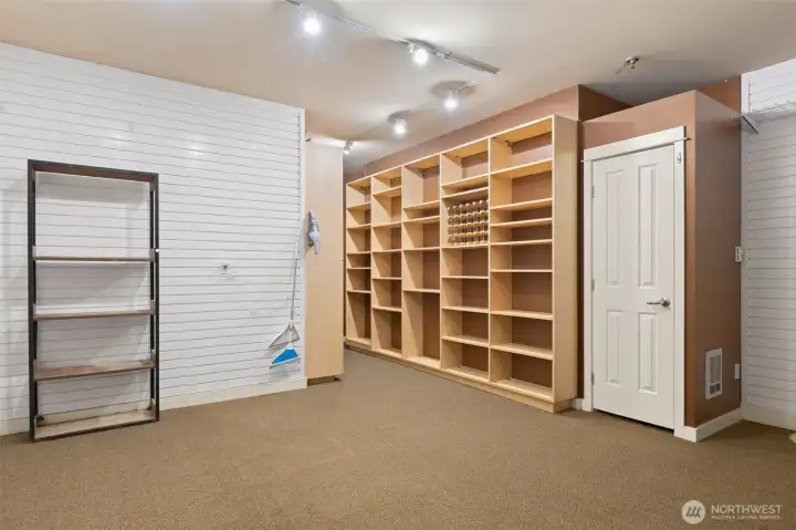 Fabulous built in shelving and extra storage closet in garage
