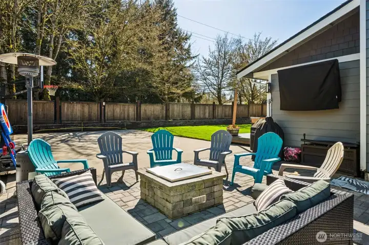 A backyard that knows how to entertain! The paver patio is already dialed in with a gas-plumbed fire pit, so you can go from zero to cozy in seconds, no firewood required. A mounted TV can stay with the home, setting the stage for outdoor movie nights or catching the game without being stuck inside. Step a little further out and you’ve got a full sport court with a basketball hoop, which is not something you come across every day. The fully fenced yard keeps everything contained and functional, while the mature trees just beyond the fence line along North Street bring in that extra layer of shade and seasonal beauty. It’s a space that makes it easy to spend more time outside, without needing to add a thing.