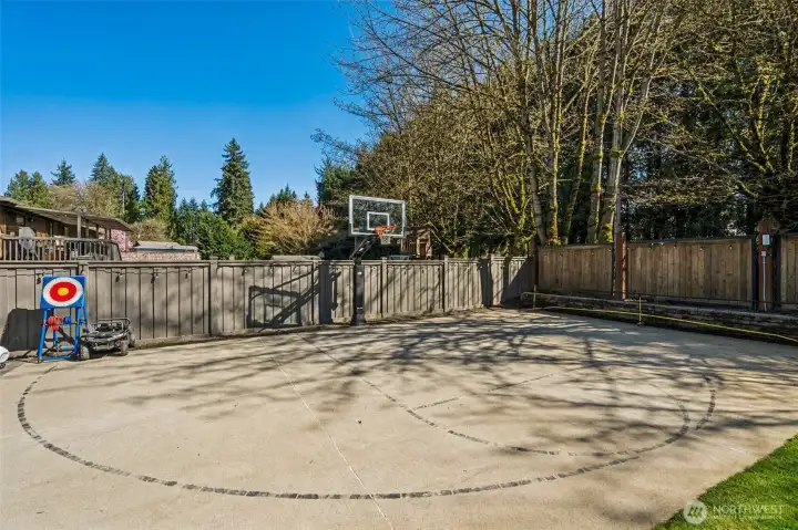 This is where the backyard really starts to show off. A full sized sport court with a glass backboard basketball hoop sets the tone, this is not a casual setup, this is game-ready. There’s enough space here for real basketball play, pickleball, or just letting kids and adults burn off energy without leaving home. It also doubles as the perfect zone for bikes, scooters, or anything with wheels that needs room to roam. It’s rare to find this kind of dedicated recreation space on a property, especially paired with a remodeled one story home in this location. It adds a whole layer of lifestyle that you just don’t get with a standard backyard.