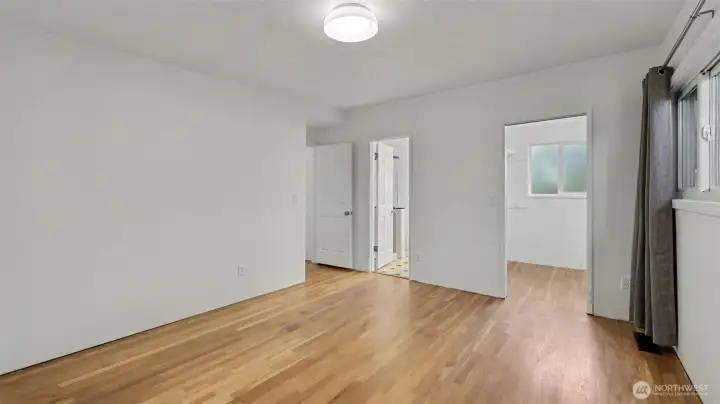 Primary bedroom with walk-in closet