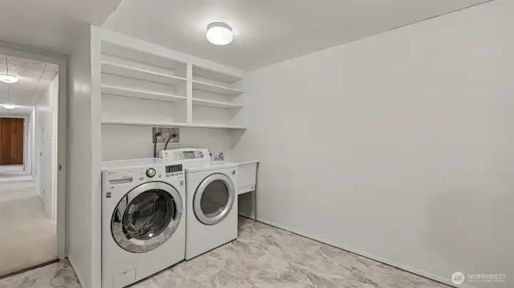 Laundry room with shelving