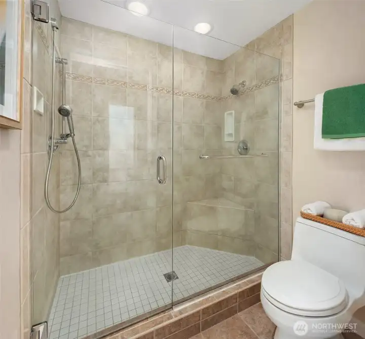 Walk in shower in the main floor primary bathroom.