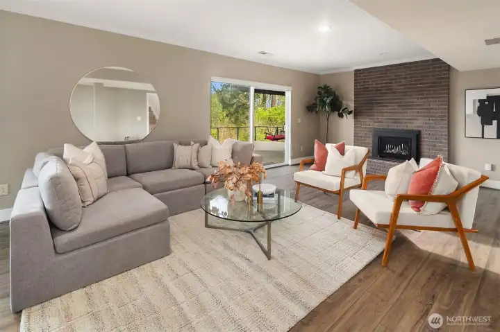 Newer gas fireplace insert adds warmth to this fantastic and spacious rec room.