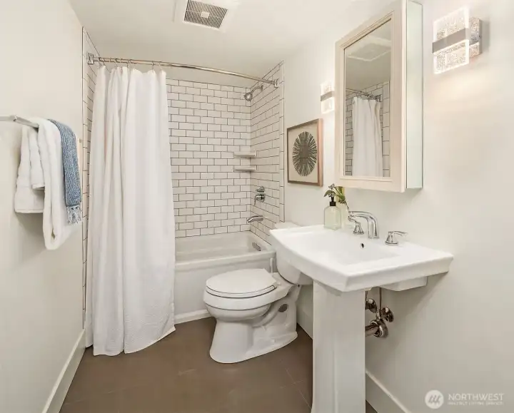Remodeled full bath on the lower level.