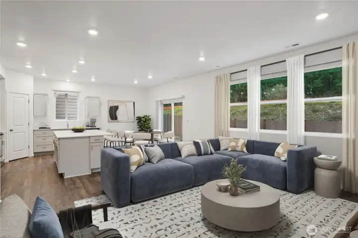 Big great room that can accommodate three couches and lots of room for relaxing together. Photo is representational. Actual home is under construction. Colors, materials, and features may vary. See site agent for details.