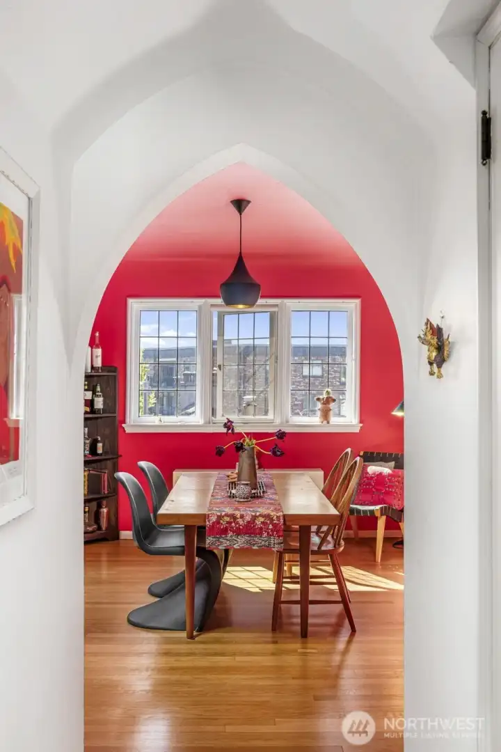 Sculptural archways draw you into a dining space filled with warmth and personality.