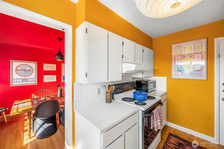 The dining room flows seamlessly into the kitchen, creating an easy transition for everyday living and entertaining.