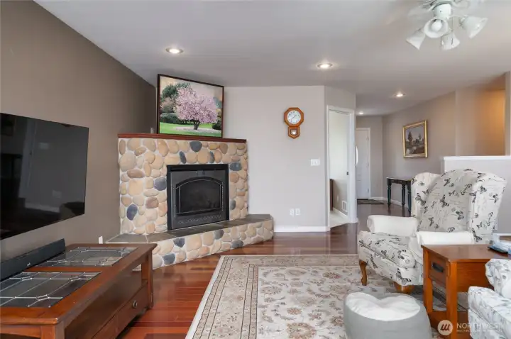 Living room with river rock fireplace for cozy winter days. Living room with river rock fireplace for cozy winter days.