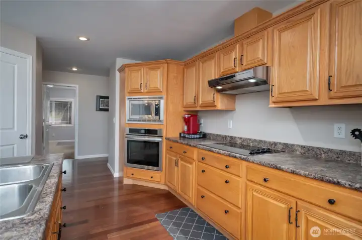 Kitchen with island and walk in pantry with ample storage. Kitchen with island and walk in pantry with ample storage.