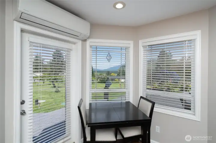 Breakfast nook with access to deck. Breakfast nook with access to deck.